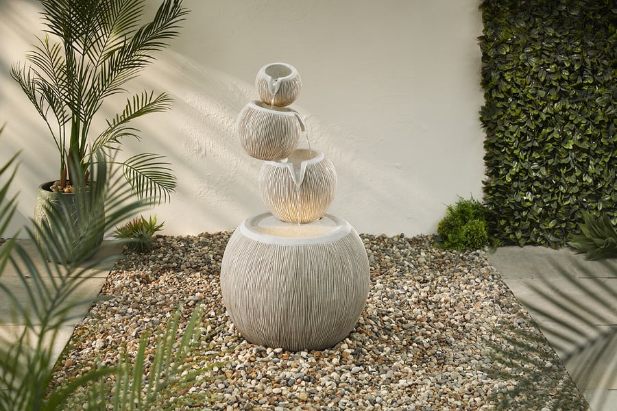 Poseidon Self Contained Water Feature with an efficient 6.7W pump, a classical pedestal water feature in a UK garden